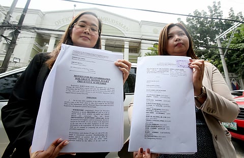 Lawyers of embattled Bamban Mayor Alice Guo show the motion for reconsideration they filed against the suspension order of the Ombudsman against their client.