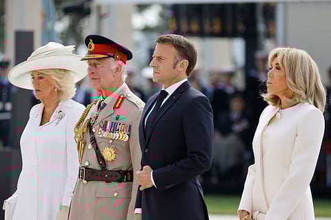 (From L) Britain's Queen Camilla, Britain's King Charles III, France's President Emmanuel Macron and French President's wife Brigitte Macron attend the UK Ministry of Defence and the Royal British Legion’s commemorative ceremony marking the 80th anniversary of the World War II "D-Day" Allied landings in Normandy, at the World War II British Normandy Memorial near the village of Ver-sur-Mer which overlooks Gold Beach and Juno Beach in northwestern France, on June 6, 2024. The D-Day ceremonies on June 6 this year mark the 80th anniversary since the launch of 'Operation Overlord', a vast military operation by Allied forces in Normandy, which turned the tide of World War II, eventually leading to the liberation of occupied France and the end of the war against Nazi Germany.