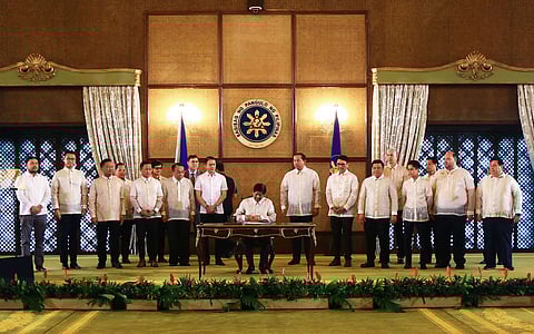 In the landscape of progress President Ferdinand ‘Bongbong’ Marcos Jr. signs two important laws — the Enactment of Negros Island Region Act (RA12000) and Real Property Valuation and Assessment Reform Act (RA12001) — as witnessed by Senate President Chiz Escudero and other members of Senate, House Speaker Martin Romualdez and other members of the House of Representatives, in Malacañang Palace, on 13 June.