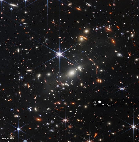 In this handout photo from NASA obtained on July 11, 2022, the first infrared image from the James Webb Space Telescope (JWST) is seen. The JWST is the most powerful telescope launched into space and it reached its final orbit around the sun, approximately 930,000 miles from Earths orbit, in January, 2022. The technological improvements of the JWST and distance from the sun will allow scientists to see much deeper into our universe with greater detail.