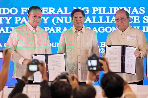 President Ferdinand ‘Bongbong’ Marcos Jr. (center) oversees the signing of the alliance between the Partido Federal ng Pilipinas and the National Unity Party at a ceremony dubbed ‘Alyansa Para Sa Bagong Pilipinas’ at the Manila Golf and Country Club. Sealing the pact are PFP national president South Cotabato Governor Reynaldo S. Tamayo Jr. (left) and NUP chairman Ronaldo V. Puno.