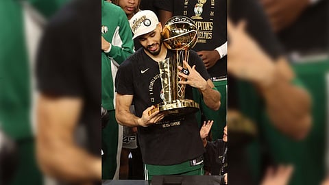 JAYSON Tatum celebrates with
the Larry O’Brien trophy after
powering the Boston Celtics to
a 106-88 win over the Dallas
Mavericks in Game 5 of their
NBA Finals series.