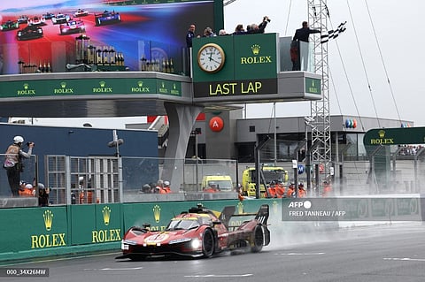 Danish driver Nicklas Nielsen in his the Ferrari 499P Hybrid Hypercar WEC's crosses the finish line to win Le Mans 24-hours endurance race in Le Mans, western France, on June 16, 2024.