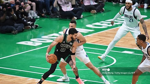 The Boston Celtics, fueled by 26 points from Jrue Holiday, thwarted a desperate Dallas rally in the final minutes to beat the Mavericks 105-98 on Sunday and take a 2-0 lead in the NBA Finals.