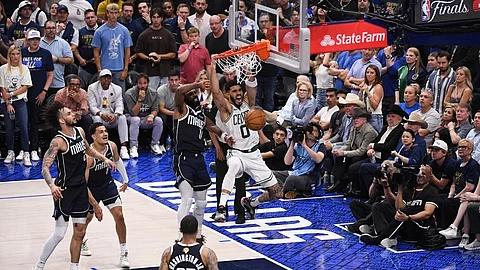 Jayson Tatum of the Boston Celtics dunks the ball.