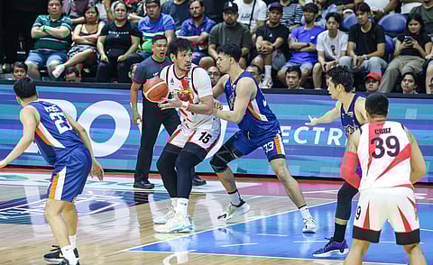 BRANDON Bates of Meralco makes life difficult for June Mar Fajardo during their PBA Philippine Cup finals series.