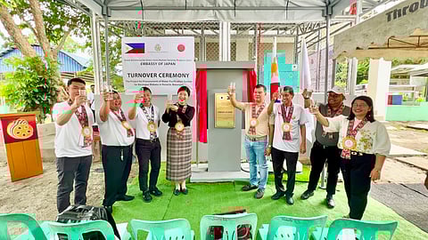 KAMPAI! Second Secretary Nishimura Tokiko of the Embassy of Japan (4th from left) and Mayor Leovigildo K. Morpe of Rosario, Batangas (4th from right) lead a taste test for drinking water coming from the newly-installed water purification system of Mabato Elementary School.