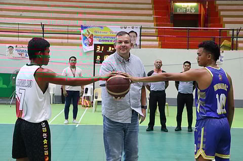 PSC chairman Richard ‘Dickie’ Bachmann makes the ceremonial toss in the basketball competition of the Philippine ROTC Games Mindanao leg.