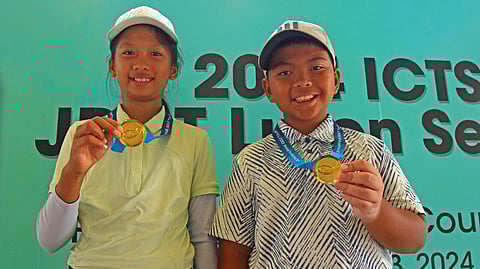 JOSE Luis Espinosa and Brianna Macasaet display their medals after ruling the 8-10 category of the Junior Philippine Golf Tour Luzon Series 3 at the Pinewoods Golf and Country Club in Baguio City.