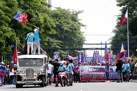 MEMBERS of the transport group Manibela en route to the Land Transportation Franchising and Regulatory Board and Land Transportation Office headquarters in Quezon City, where they would figure in a violent protest action.