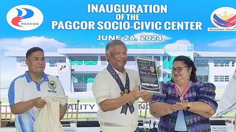 PAGCOR Chairman Alejandro Tengco receives a plaque of appreciation