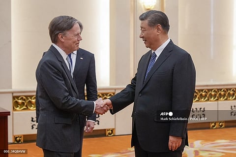 FILES: US Ambassador to China Nicholas Burns (L) shakes hands with China's President Xi Jinping before the latter's meeting with US Secretary of State Antony Blinken (not pictured) at the Great Hall of the People in Beijing on April 26, 2024.