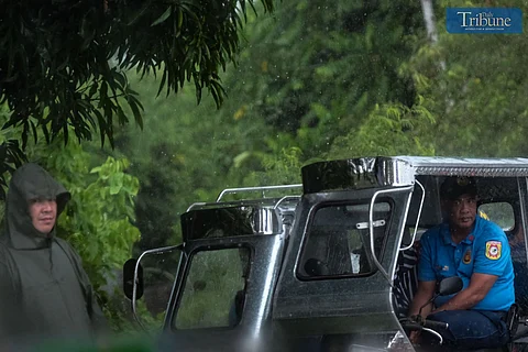TRIBUNE-rain-on-tricycle