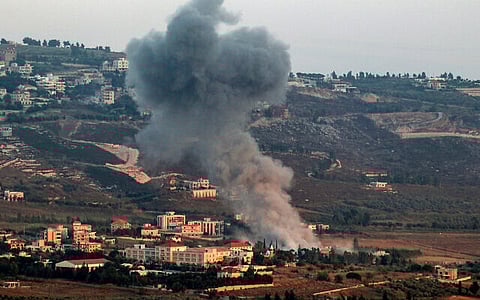 A smoke plume billows during an Israeli strike on the village of Khiam in southern Lebanon on June 23, 2024.