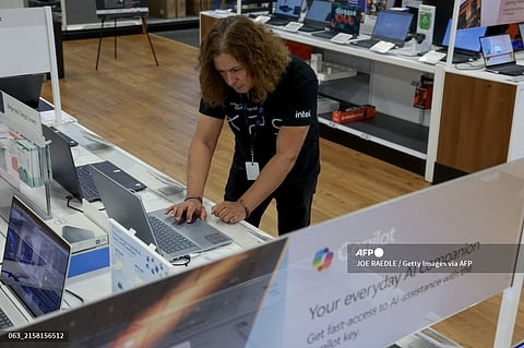 Omar Sawaya, with Dell computer, looks at computers on display with the Microsoft Copilot+ installed at the Best Buy store on June 18, 2024 in Miami, Florida. Today, Best Buy began selling Microsoft's new line of AI-centric Copilot+ PCs to customers. The store has the most extensive assortment of Copilot+ PCs in their stores from vendors like Microsoft, Dell, HP, Lenovo, and Samsung. Microsoft Copilot is a generative artificial intelligence chatbot developed by the company.