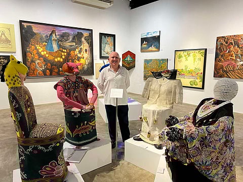 The author among the textile sculptures of Valeria Cavestany.