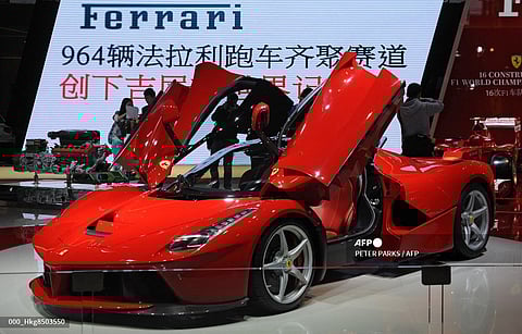 This photo taken on April 20, 2013 shows a Ferrari F150 V12 hybrid electric supercar car on display on media day at the Shanghai auto show.