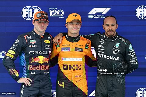 (From L) Red Bull’s Netherland driver Max Verstappen, McLaren’s British driver Lando Norris and Mercedes British driver Lewis Hamilton pose after the qualification session at the Circuit de Catalunya on June 22, 2024 in Montmelo, on the outskirts of Barcelona, during the Spanish Formula One Grand Prix. McLaren's Norris is on pole for Spanish Grand Prix on June 23, 2024.