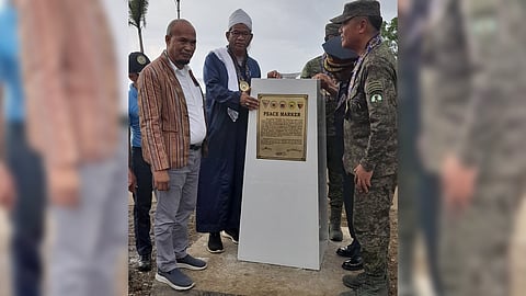 The local government unit of Akbar town in Basilan province ‘unveiled a peace marker’ marking the end of the ASG era in the municipality. Photo shows Akbar Mayor Alih A. Sali (left), Manny Muarip (2nd from left) provincial administrator, and 101st Infantry (Three Red Arrows) Brigade Commander Brig. Gen. Alvin V. Luzon (right).