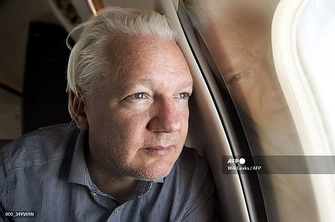This handout courtesy of the WikiLeaks X account @wikileaks posted on June 25, 2024 shows WikiLeaks founder Julian Assange looking out of the window as his plane from London approaches Bangkok for a layover at Don Mueang International Airport in the Thai capital. WikiLeaks founder Julian Assange has been released from prison in Britain and is set to face a final court hearing after reaching a plea deal with US authorities that brings to a close his years-long legal drama. A charter plane flew the 52-year-old from London to Bangkok, where it made a scheduled stop to refuel.