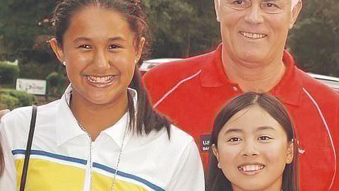 An 11-year-old Yuka Saso (right) poses with Sam Bruce (left) and US Kids Golf founder Dan Van Horn during the opening ceremonies of the 2012 USKG World Championships.