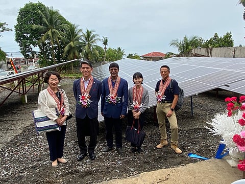 JAPANESE Ambassador Endo Kazuya (2nd from left) and his staff pose at the solar panels powering the ice block-making facility in Molave Street, Poblacion 1, Parang, Maguindanao del Norte on 19 June.