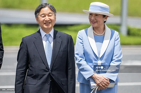 Japan's Emperor Naruhito (L) and Empress Masako (R) arrive at Haneda airport before the Emperor and Empress' departure for Britain, in Tokyo on June 22, 2024.