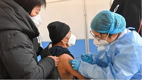 (FILES) An elderly man receives a COVID-19 vaccine.