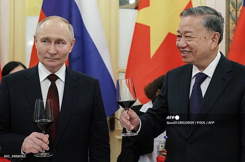 In this pool photograph distributed by the Russian state agency Sputnik, Russia's President Vladimir Putin (L) and Vietnam's President To Lam (R) toast during a reception at the Hanoi Opera House in Hanoi on June 20, 2024. Russia and Vietnam pledged on June 20, 2024 to deepen ties as President Vladimir Putin made a state visit aimed at bolstering his alliances to counter Moscow's growing isolation over the war in Ukraine.
Gavriil GRIGOROV / POOL / AFP