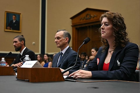 Former US Olympians Michael Phelps (left) and Allison Schmitt flanking US Anti-Doping Agency CEO Travis Tygart as they testify before a US Congress subcommittee hearing on anti-doping measures ahead of the 2024 Paris Olympics.