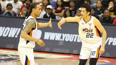 Chris Newsome (left) and Allein Maliksi join hands in leading Meralco to a 92-88 win over defending champion San Miguel in Game 5 of the PBA Philippine Cup last Friday. The Bolts lead the best-of-seven series at 3-2.
