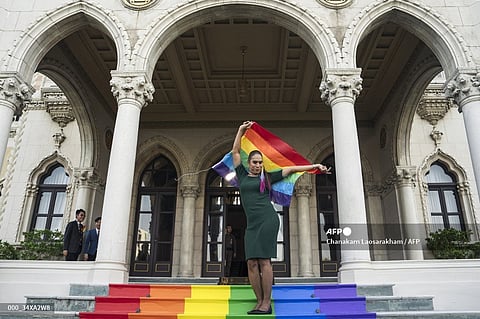 A member of the LGBTQ community celebrates after the Thai parliament passed the final senatorial vote on the same sex marriage bill, at Government House in Bangkok on June 18, 2024. Thailand on June 18 became the first country in Southeast Asia to legalise same-sex marriage, in a historic parliamentary vote hailed as a "victory" by campaigners.