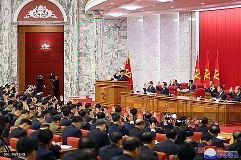 This picture taken on June 29, 2024 and released from North Korea's official Korean Central News Agency (KCNA) via KNS on June 30, 2024 shows North Korea's leader Kim Jong Un (C) taking part in the second day of the 10th enlarged plenary session of the 8th Central Committee of the Workers' Party of Korea at an undisclosed location.