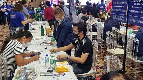 (FILES) Jobseekers troop to the job and business fairs at the Kingsborough International Convention Center in the City of San Fernando, Pampanga in line with the celebration of Labor Day on Sunday, 1 May 2022.