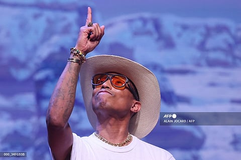 US rapper, artist and fashion designer Pharrell Williams acknowledges applause after presenting creations for the Louis Vuitton Menswear Ready-to-wear Fall-Winter 2024/2025 collection as part of the Paris Fashion Week, in Paris on January 16, 2024.