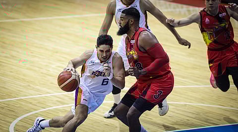 Chris Banchero throws in 18 points to help Meralco overcome defending champion San Miguel Beer, 93-86, in Game 1 of the PBA Philippine Cup finals Wednesday night at the Smart Araneta Coliseum.