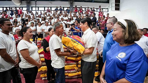 (FILES) President Ferdinand R. Marcos Jr. ensures that no one goes hungry as he personally oversees the distribution of food stamps and 25-kilo sacks of rice to each 4Ps beneficiary in Surigao del Norte.