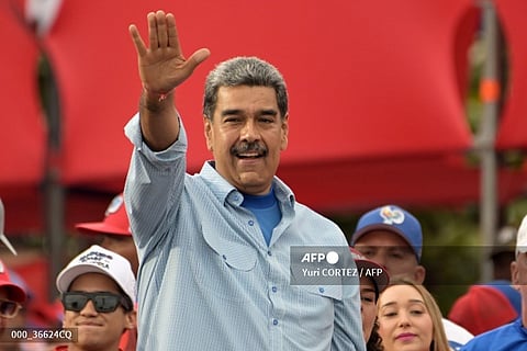 Venezuelan President and presidential candidate Nicolas Maduro greets supporters at his campaign closing rally in Caracas on July 25, 2024, ahead of Sunday's presidential election. Venezuelan President Nicolas Maduro and his main rival in the July 28 presidential elections, opposition candidate Edmundo Gonzalez Urrutia, close their campaigns on Thursday amidst Maduro's warnings of a "bloodbath" or a military insurrection if he is defeated.