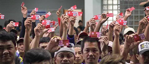 (FILE PHOTO) ‘Walang Gutom 2027’ Program beneficiaries from Palo, Leyte get their food stamp cards at the Palo Sports Complex on 18 July 2024.