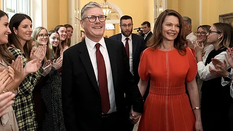 Newly elected Prime Minister Sir Keir Starmer with his wife Victoria Starmer enter his official London residence at No 10 Downing Street for the first time after the Labour Party won a landslide victory at the 2024 General Election.