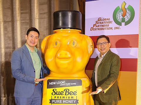 Peter and Patrick Tiope present the Sue Bee Honey new packaging.