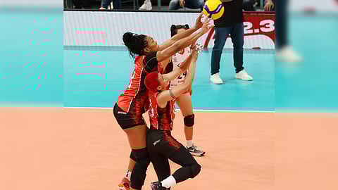 Ara Galang and import Khat Bell join hands in helping Chery Tiggo score a 25-16, 25-20, 25-23 win in the PVL Reinforced Conference at the Philsports Arena in Pasig.