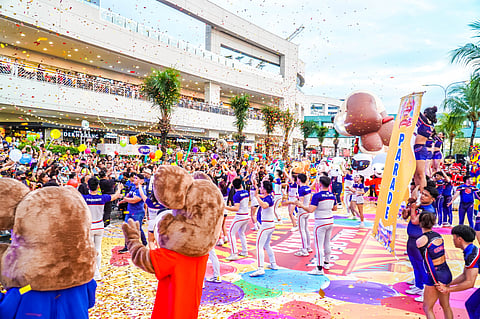 A crowd gathers to watch animated characters at the Grand Mascot Parade in SM Mall of Asia.