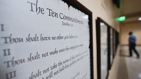 FILE - A copy of the Ten Commandments is posted along with other historical documents in a hallway of the Georgia Capitol, Thursday, June 20, 2024, in Atlanta. Louisiana agreed Friday, July 19, 2024 to delay implementing a requirement that the Ten Commandments be placed in all of the state’s public school classrooms until at least November, as a lawsuit makes its way through the courts.