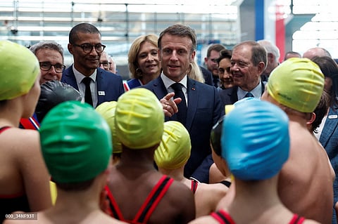 French President Emmanuel Macron says he would still take a dip in the River Seine.