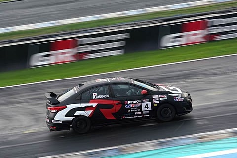TOYOTA Motor Philippines president Masando Hashimoto drives the No. 4 car in Novice Class.