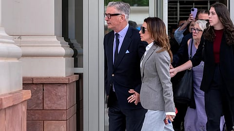 Alec Baldwin and his wife Hilaria Baldwin leave Santa Fe’s First District Court following the dismissal of his involuntary manslaughter charge.