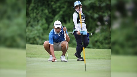 JOSE Carlos Taruc reads the green en route to winning the boys’ 13-15 category of the ICTSI JPGT Luzon Series 4 at the Riviera Golf and Country Club.