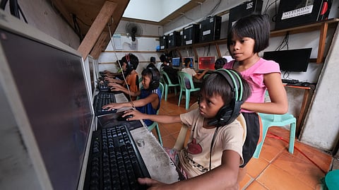 (FILES) Children in an internet cafe in Cagayan de Oro City on 24 July 2023.