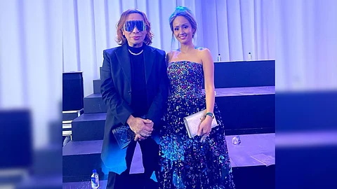 Designer Michael Cinco and Happy Melendres.